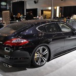 2011 black Porsche Panamera Turbo S at New York Autoshow Rear angle side view