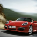 2011 Guards Red Porsche Boxster S wallpaper Front angle view