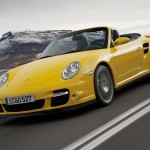 2008 Yellow Porsche 911 Turbo Cabriolet Wallpaper Fronta angle view In motion