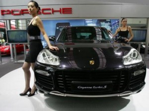 Black Porsche Cayenne Turbo S and girls